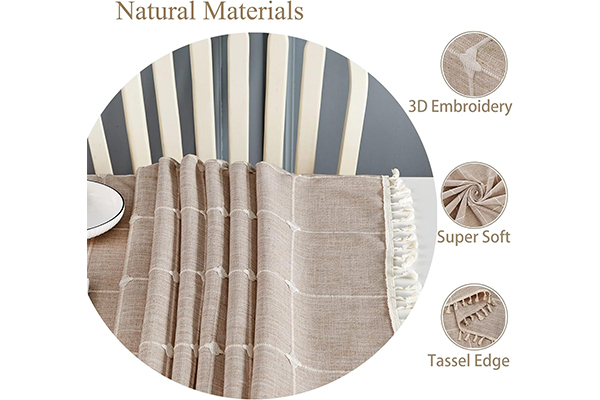 When purchasing a fabric table cover for kitchen, in addition to material and design, what other details should be considered to enhance the user experience?